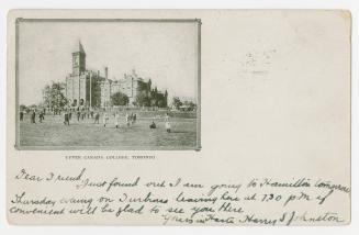 Black/white postcard depicting the main building and lawns at Upper Canada College in Toronto. …