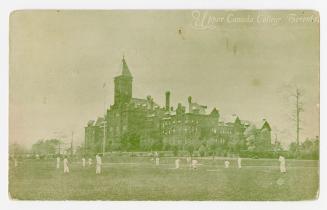 Black/white postcard (appearing green-toned) depicting the main building and lawns at Upper Can…