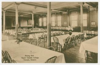 Sepia toned photograph of the inside of a dining hall with caption "Dining Hall//Upper Canada C…