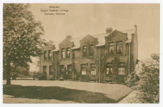 Sepia toned photograph of a two story medical building with caption "Hospital//Upper Canada Col…