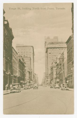 Sepia toned photograph a busy downtown street with skyscrapers.