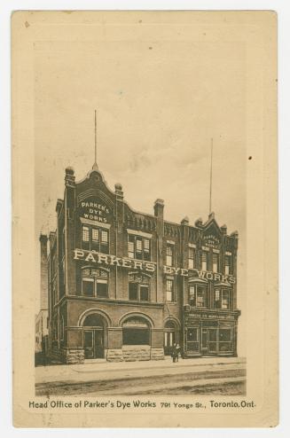 Sepia toned photograph of a large factory and office building.