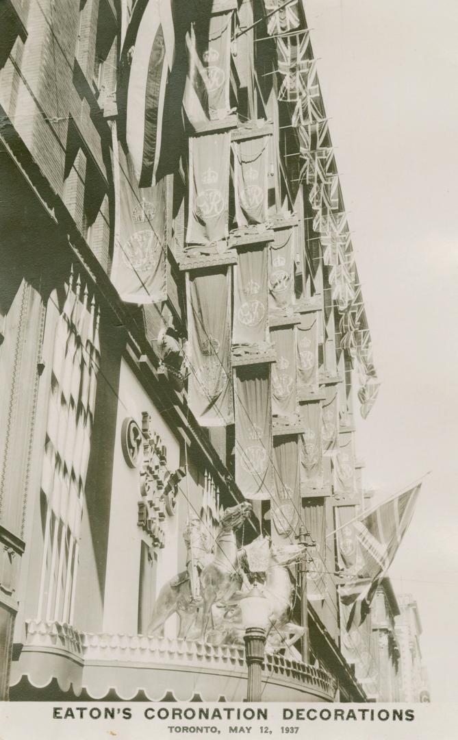 Picture of building decorated with flags and bunting. 