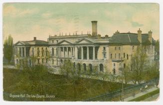 Side view of large law buildings and front lawn. 