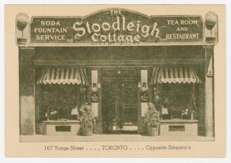 Black and white photograph of the front entranceway of a restaurant.