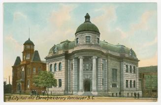 Picture of large stone library building with corner tower. 