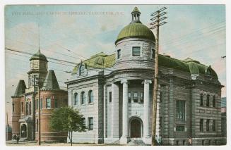 Picture of large stone library building with corner tower. 