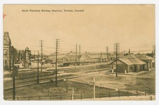 Sepia-toned postcard depicting a photo a railway yard with caption, "North Parkdale Railway Sta…