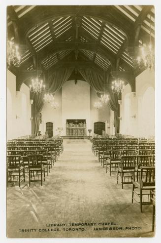 Sepia-toned postcard depicting a photo of the interior of the library and temporary chapel at T…