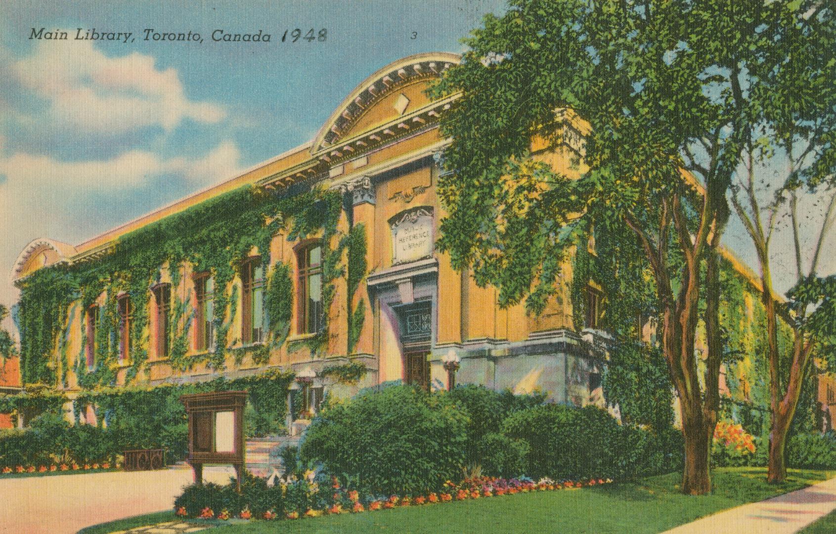 Picture of a large library building on street corner.