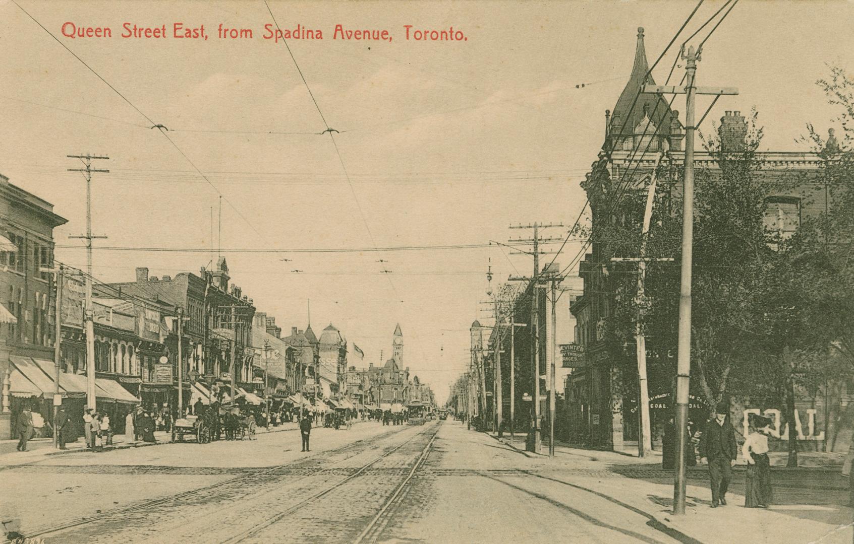 Picture of a wide street with buildings on both sides. 