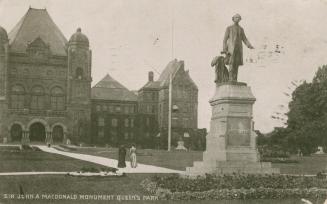 Black and white photograph of a huge Richard Romanesque building with a statue of a man in a fr…