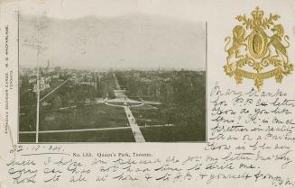 Black and white photograph of people walking on pathways in a large urban park. White border ar…