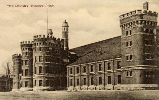 Black and white photograph of a very large Romanesque Revival, castle-like structure. 