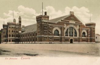 Colorized photograph of a very large Romanesque Revival, castle-like structure. 