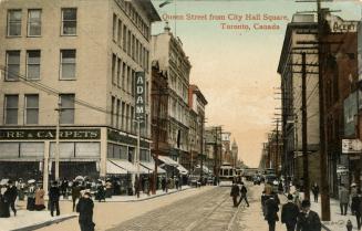 Colour postcard depicting a photo of Queen Street looking east towards an approaching trolley c…