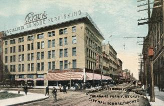 Colour postcard depicting a photo of the exterior of Adams Furniture Company, with caption, "Ca…