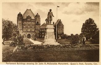 Picture of a monument with parliament buildings in background. 