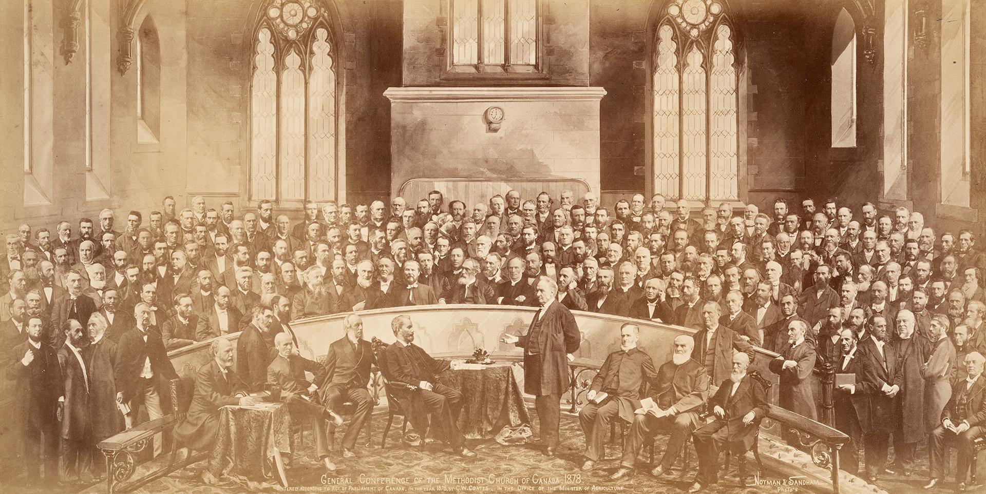 A composite photograph of a conference meeting taking place in a church, with several dozen men…