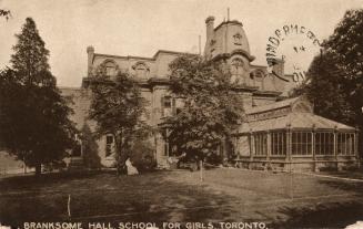 Black and white photograph of a very large Victorian building complex and grounds.