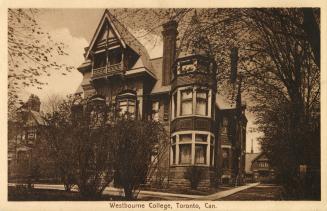 Sepia toned photograph of a three story Victorian building which was once a grand house.