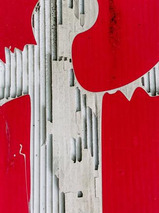 A close-up photograph of a surface covered in posters and graffiti. Portions of posters, some o ...