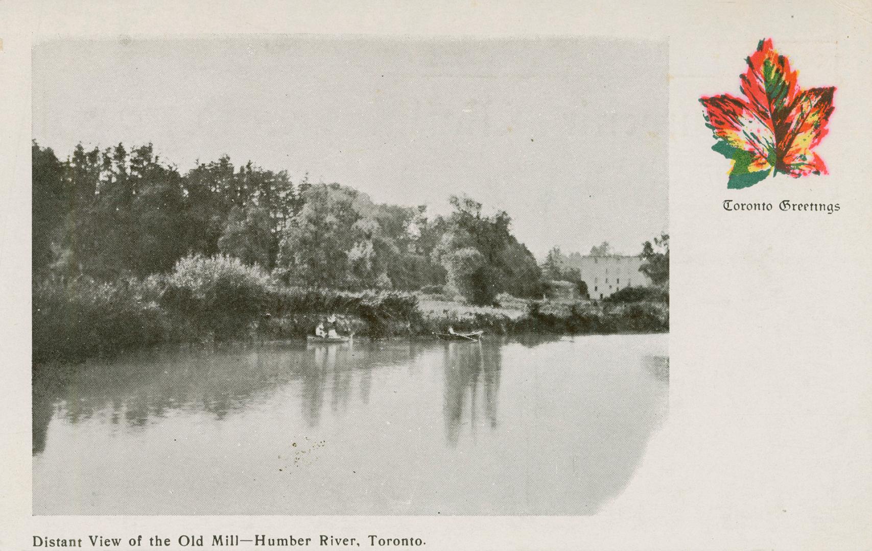 Black and white picture of boats on a river with a large, square building in the background.