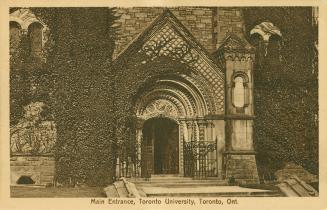 Sepia toned photograph of an elaborate front door to a stone building.