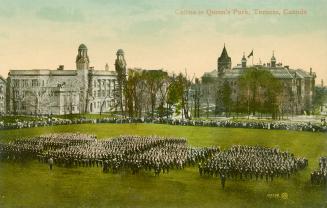 Colorized photograph of two very large buildings with groups of soldiers marching in formation …