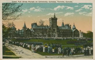 Colorized photograph of a very large stone building with many towers. Soldiers on parade in fro…