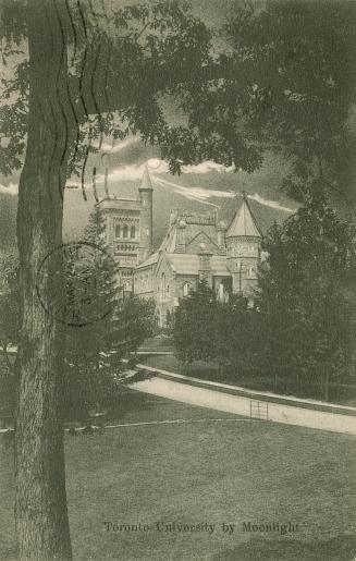 Black and white photograph of a very large stone building with many towers. Full moon is visibl ...