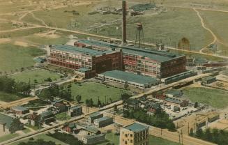 Colour postcard depicting an illustration of a large warehouse building surrounded by adjacent …