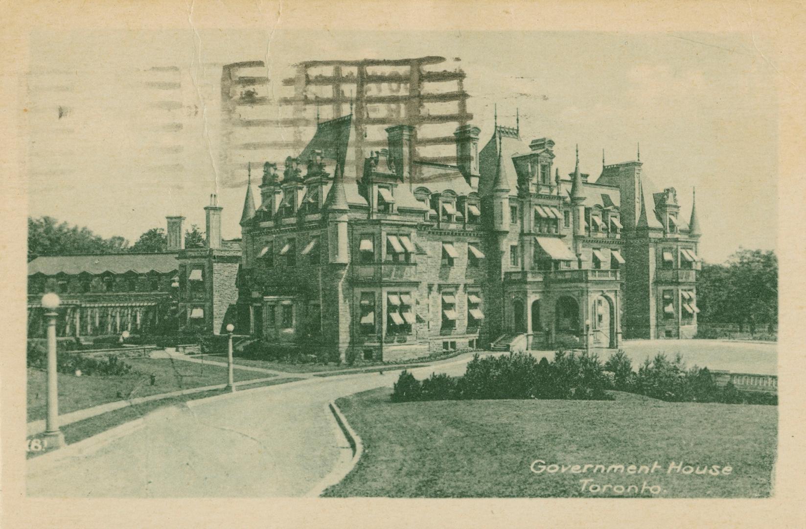 Black and white photograph of a very large mansion in the French Loire Chateau style. Turrets, …