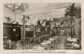 Black and white photograph of rows of empty tables and chars in a dining room.