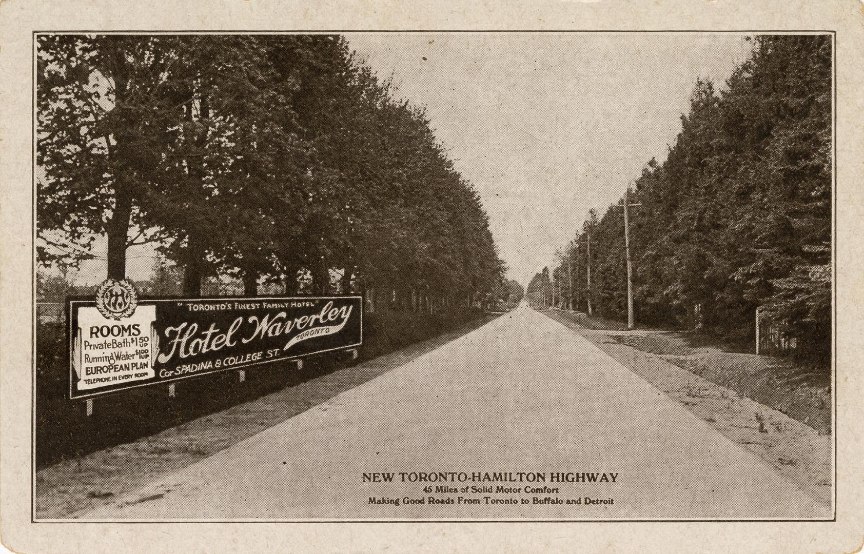 Black and white photo postcard depicting old Lakeshore Road, now Highway 2, with a big sign on …