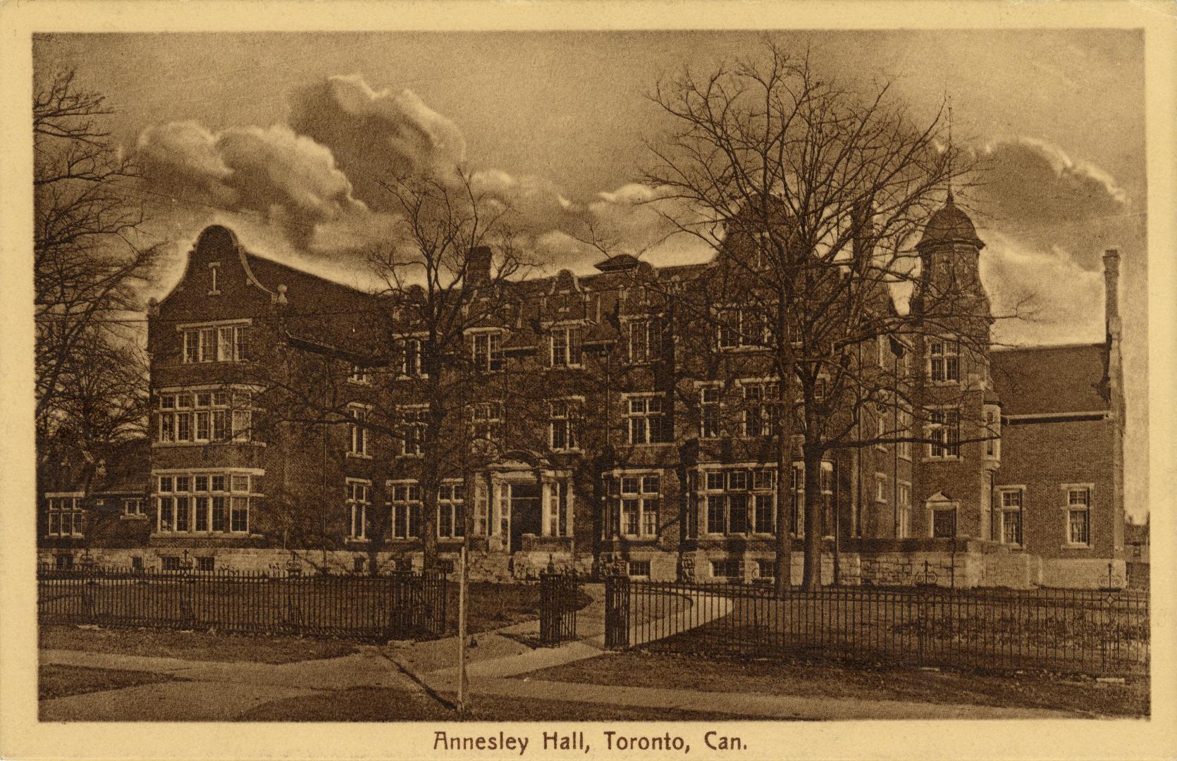 Dark sepia-toned photo postcard depicting a building known as Annesley Hall on Queen's Park Cre…