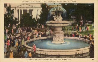 Colorized photograph of crowds of people walking in front of a very large, marble fountain whic…