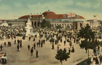 Colorized photograph of crowds of people waling on roads in front of large gates and arenas. La…