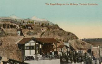 Colorized photograph of a shed-like structure in the middle of a hill. Wooden pathway leading u…