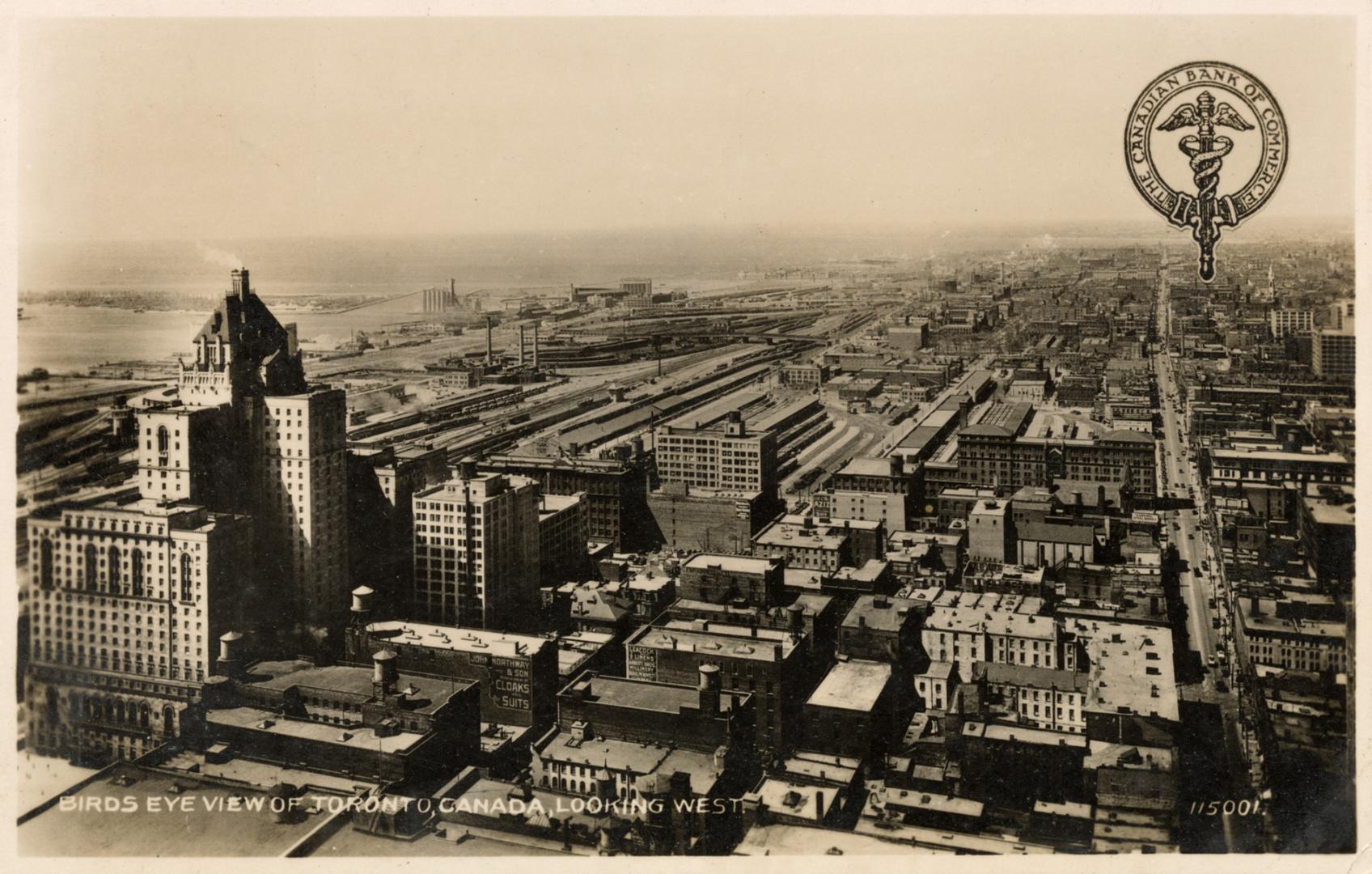 Black and white photograph of an aerial view of a large city downtown area with skyscrapers.