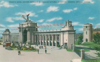 Colorized photograph of a large, neoclassical archway made of cement and stone. People are walk…