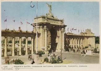 Color photograph of a large, neoclassical archway made of cement and stone.