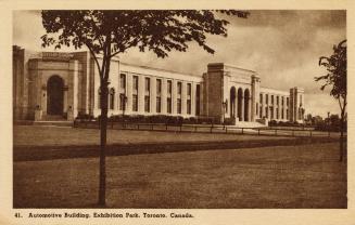 Sepia toned photograph of a two story building in the Beaux Arts style. Tall arches over the en ...