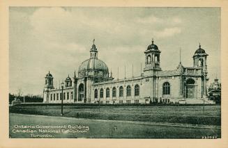 Sepia toned photograph of a two story building in the Beaux Arts style. Cupola in the centre be…