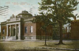 Picture of large public library with front pillars and dome on the roof and large tree to the r…