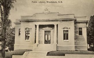 Picture of one storey brick and grey stone library building. 