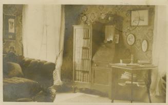 Black and white photograph of a living room interior.