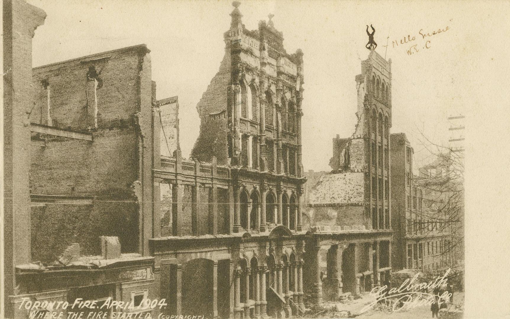 Black and white photo postcard depicting a row of buildings damaged by the 1904 fire of Toronto…