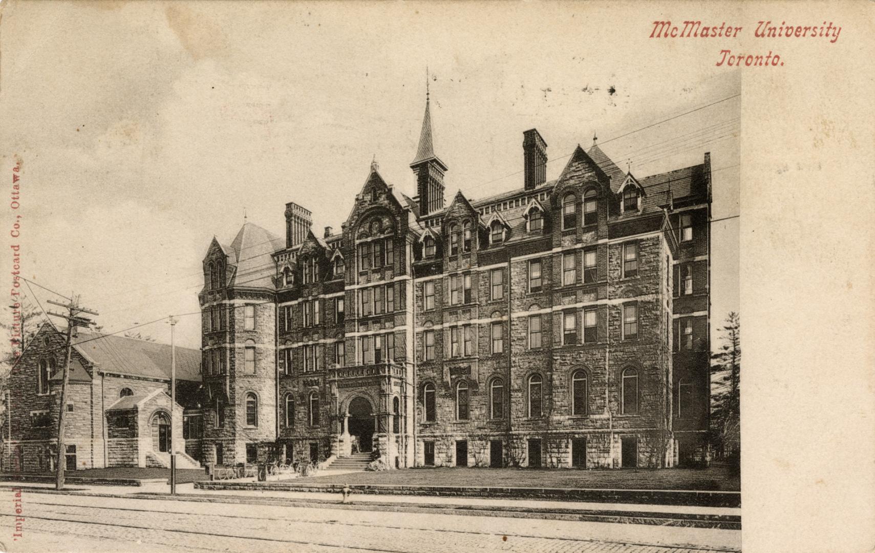 Black and white photograph of a very large late Victorian design building.