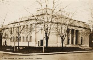 Black and white photograph of a large, square building.